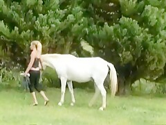 Cute blonde fucks dildo and sucks horse